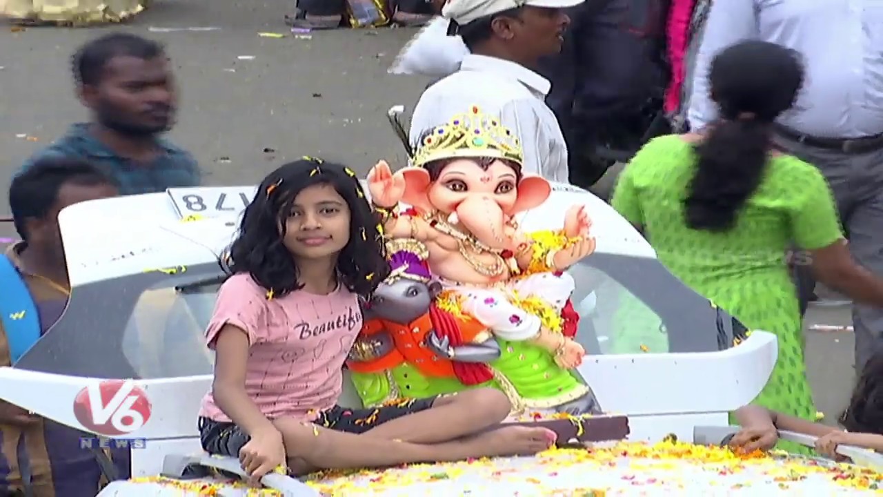 Little Girl Taking Lord Ganesh Idol For Immersion